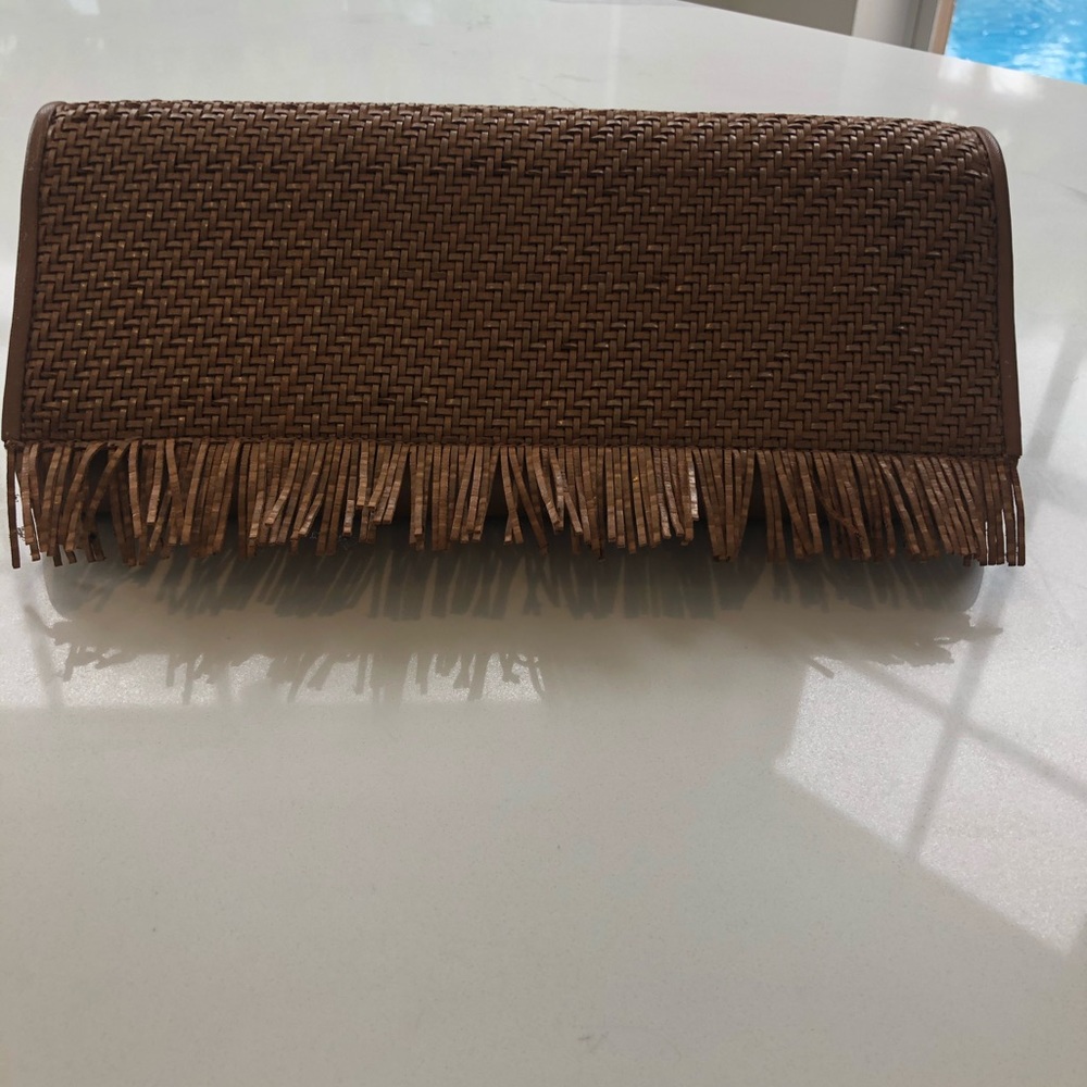 Authentic Stuart Weitzman clutch . Color cognac .